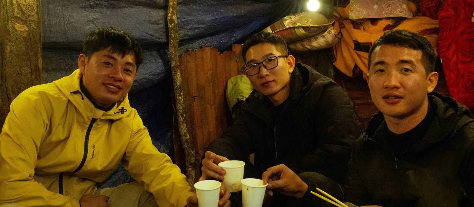 Friends raising a toast together at an evening gathering